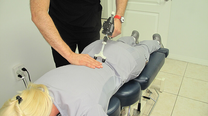 chiropractor using a Arthrostim 